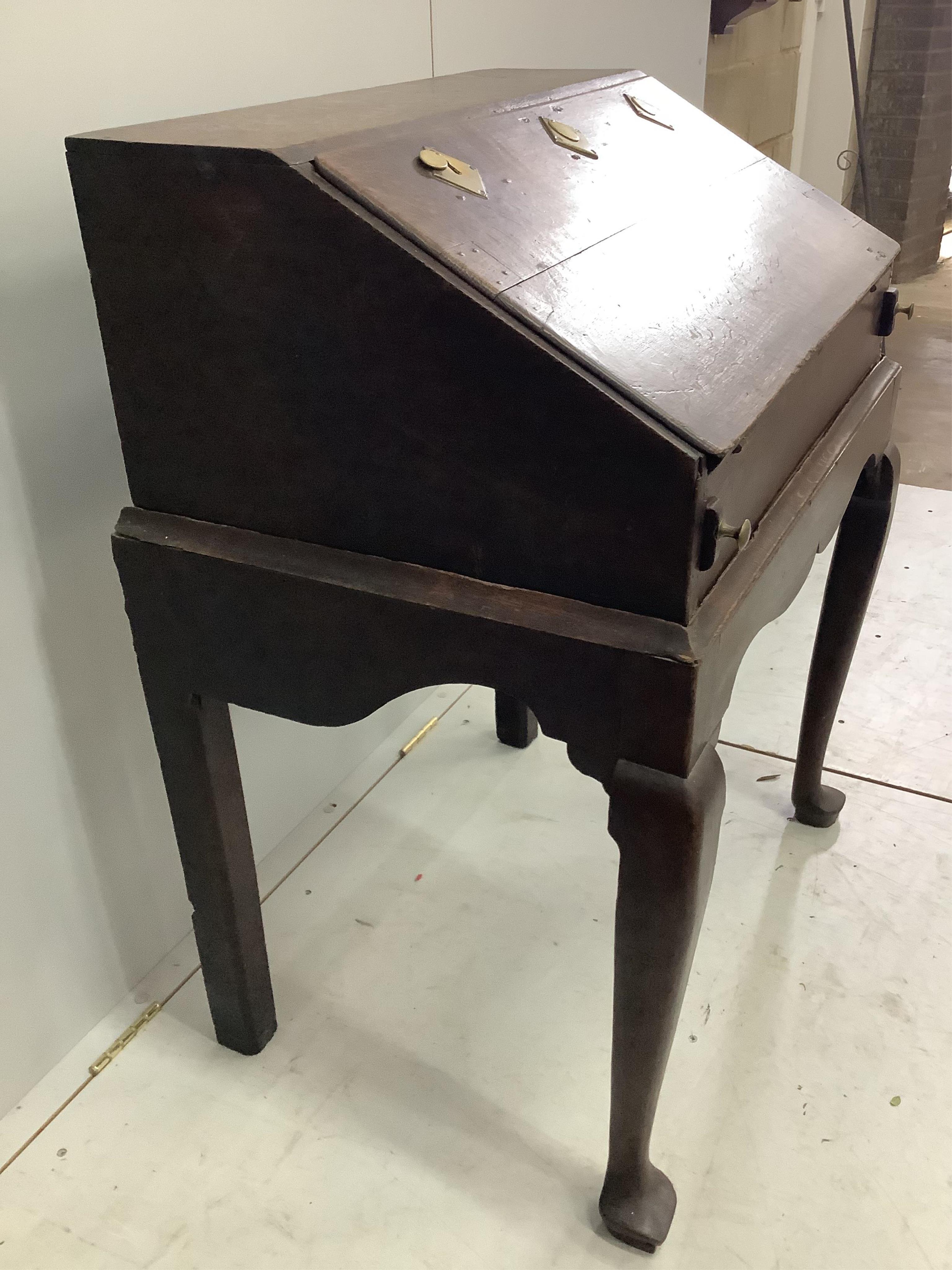 A late 18th century oak bureau on stand, width 78cm, depth 54cm, height 97cm. Condition - fair